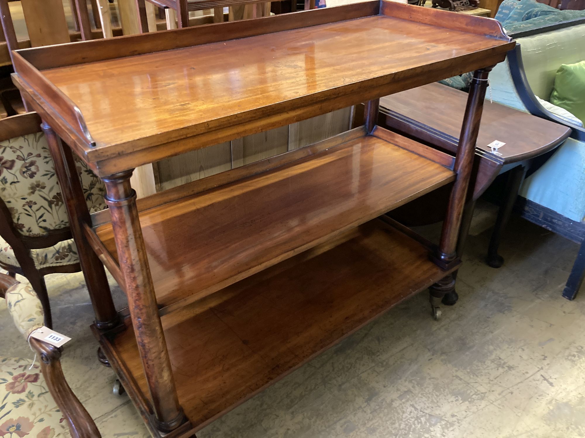 A Victorian mahogany three tier buffet, length 122cm, depth 53cm, height 110cm